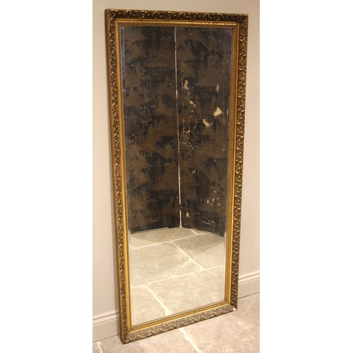 615 - A 19th century style gilt composite wall mirror, late 20th century, the leaf moulded frame and beade... 