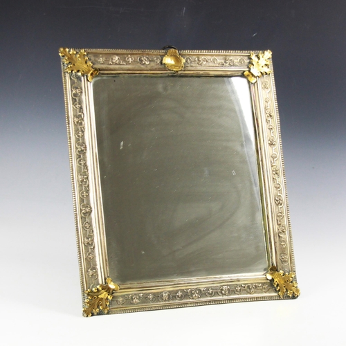 62 - A 19th century silver coloured and gilt metal dressing table mirror, of rectangular form with stylis... 