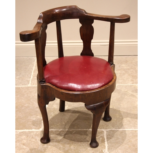 674 - George II walnut corner chair, the out scrolled top rail upon twin vase shaped splats, punctuated wi... 