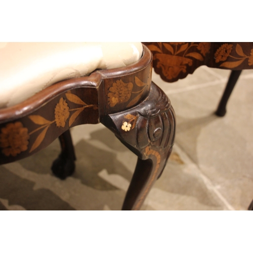 677 - A set of three Dutch marquetry walnut dining chairs, 18th century and later, each with a shell carve... 