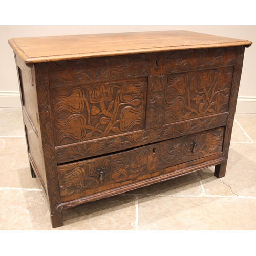 681 - A 17th century and later carved oak mule chest, the hinged twin plank moulded top opening to a vacan... 