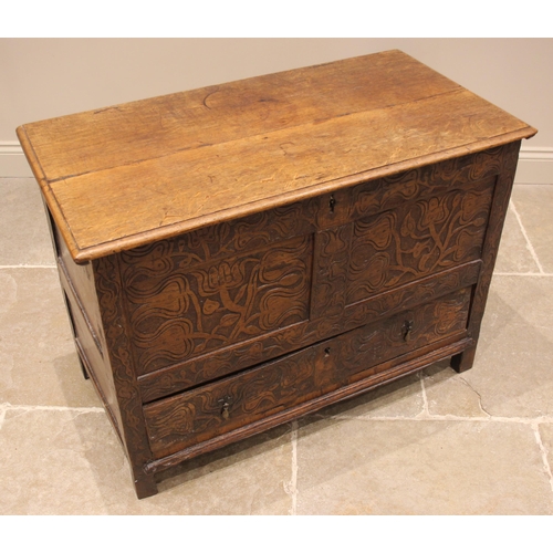 681 - A 17th century and later carved oak mule chest, the hinged twin plank moulded top opening to a vacan... 