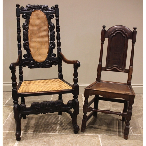 683 - A walnut Carolean open armchair, late 17th century, the high back with a carved coronet crest over t... 