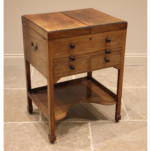 693 - A mahogany gentleman’s 'Beau Brummel' dressing table , 19th century, the flame mahogany twin hinged ... 