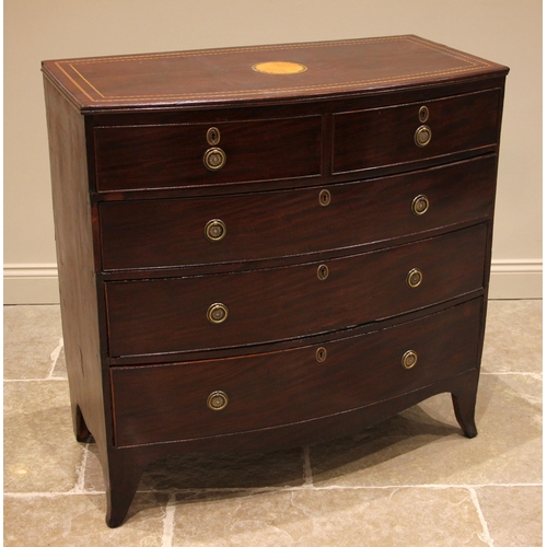 695 - An early 19th century mahogany bowfront chest of drawers, the top centred with an inlaid circular sa... 