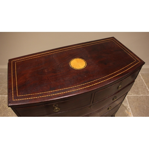 695 - An early 19th century mahogany bowfront chest of drawers, the top centred with an inlaid circular sa... 