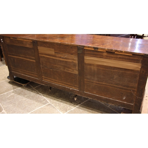 698 - A George III oak and mahogany cross banded Lancashire dresser base, the plank top with rounded front... 