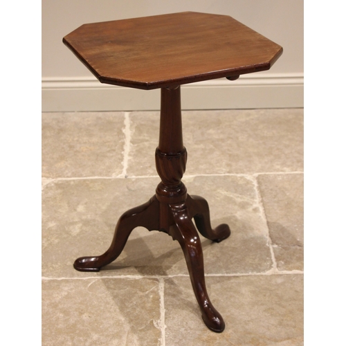 700 - A George III mahogany tilt top tripod table, the square top with canted corners upon a tapering colu... 