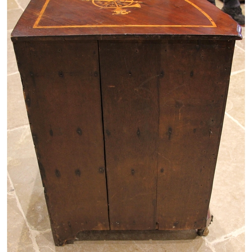 707 - A George III inlaid mahogany freestanding corner cabinet, the fan shaped top inlaid with satinwood c... 