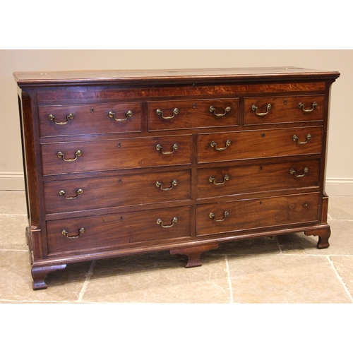 709 - A George III mahogany Lancashire mule chest, the hinged and moulded top over a cross banded frieze o... 