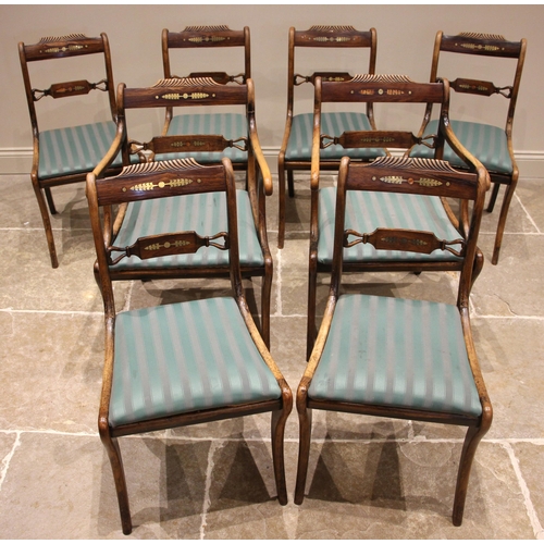 711 - A set of eight Regency simulated rosewood Trafalgar dining chairs, each with a brass inlaid and gadr... 