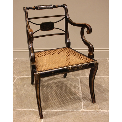 713 - A Regency gilded and ebonised elbow chair, in the manner of Thomas Hope, the turned top rail applied... 