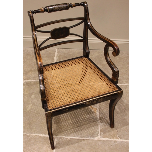 713 - A Regency gilded and ebonised elbow chair, in the manner of Thomas Hope, the turned top rail applied... 