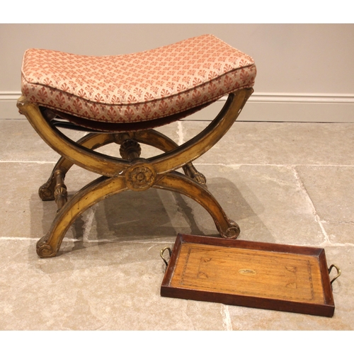 717 - A Regency giltwood and gesso 'X' form stool, the later upholstered seat cushion upon a moulded frame... 