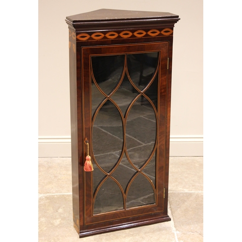 731 - An inlaid mahogany Sheraton revival corner display cabinet, 19th century, the moulded cornice over a... 