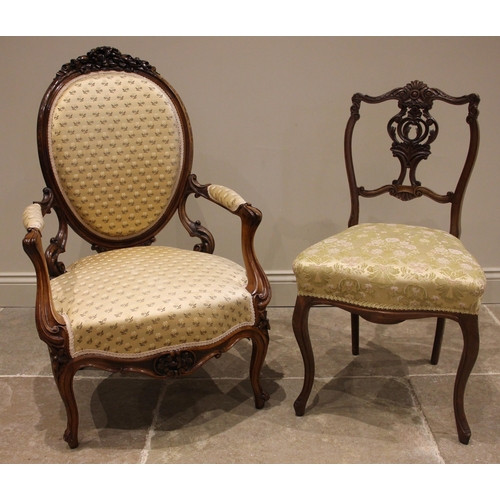 737 - A Louis XV style walnut framed fauteuil, late 19th century, the foliate carved crest over an oval ba... 