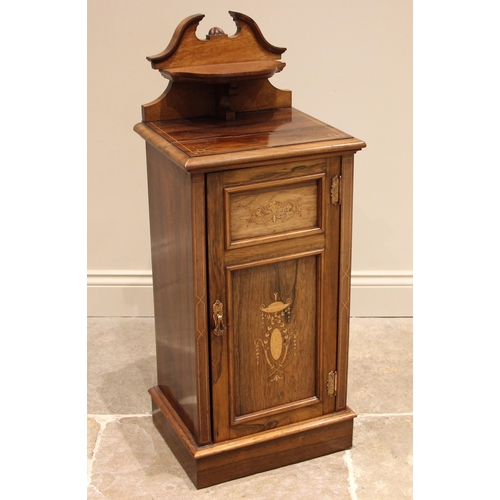 741 - An Edwardian rosewood pedestal bedside cupboard, by Thomas Edwards & Sons, the shaped pediment with ... 