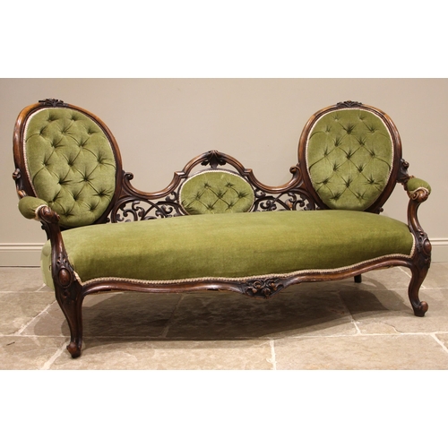 745 - A Victorian walnut framed double spoon back sofa, in green velour, the pair of oval button back rest... 