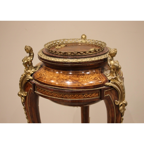 746 - A 19th century style French walnut and kingwood jardiniere stand, inlaid with foliate and scroll mot... 