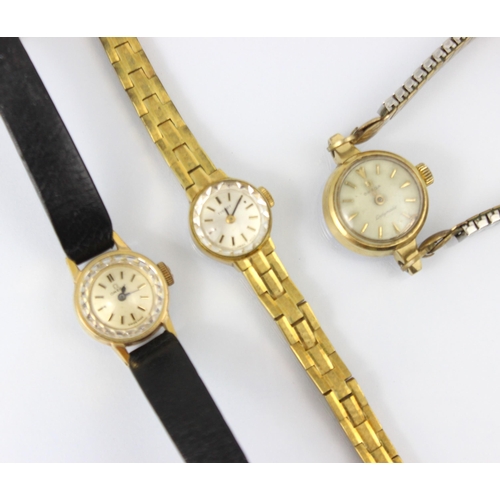 75 - A group of three ladies wristwatches, including an Omega Ladymatic example, the circular cream dial ... 