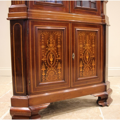 750 - A Sheraton revival inlaid mahogany freestanding corner display cabinet, 19th century, the moulded de... 