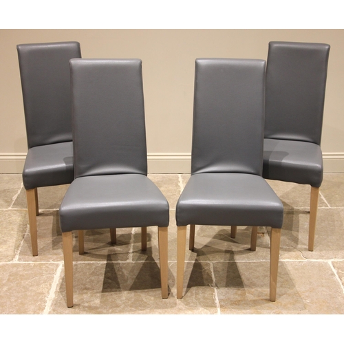 786 - A set of four contemporary slate grey leather dining chairs, each with a padded high back upon taper... 