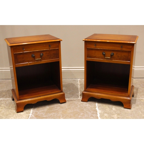 790 - A pair of yew veneered bedside/lamp tables by Bradley Furniture, late 20th century, each with a cros... 