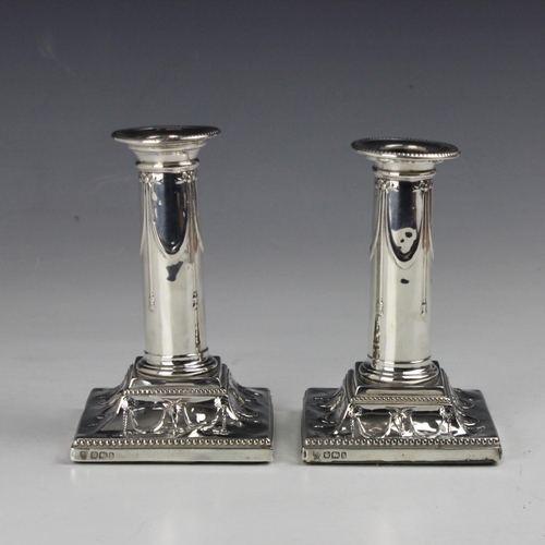 8 - A pair of Victorian silver dwarf candlesticks, Hawksworth, Eyre & Co Ltd, Sheffield 1900, the beaded... 