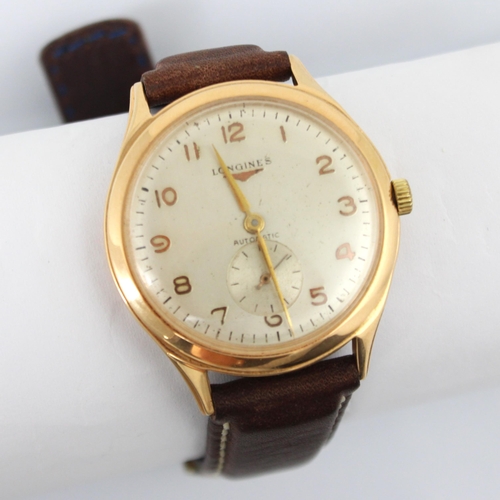 86 - A yellow metal cased Longines automatic wristwatch, the circular cream coloured dial with subsidiary... 