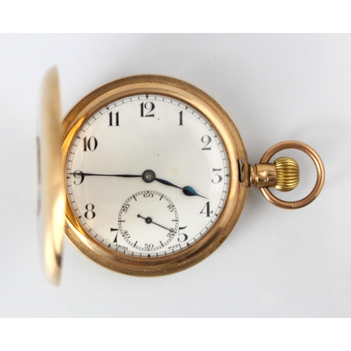 88 - An early 20th century 9ct gold half hunter pocket watch, the white circular dial with Arabic numeral... 