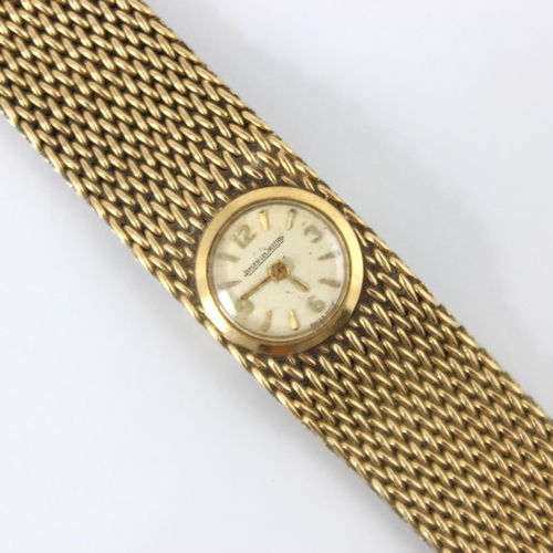 91 - A 9ct Jaeger Le-Coultre ladies wrist watch, the cream coloured dial with baton and Arabic numerals, ... 