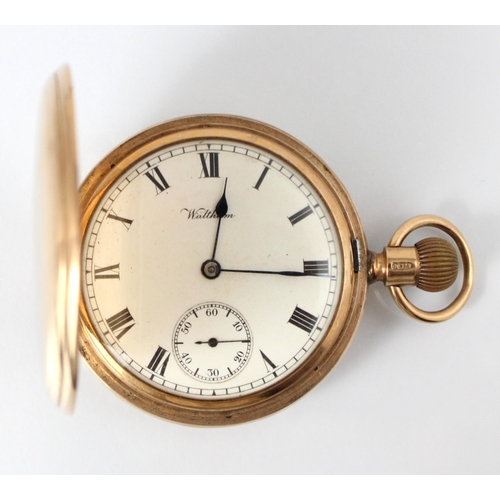 92 - An early 20th century 9ct full hunter Waltham pocket watch, the circular white enamel dial with Roma... 