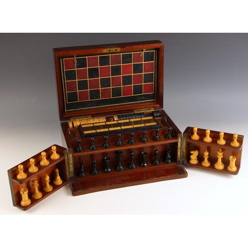 580 - A 19th century mahogany games compendium, the hinged cover and front opening to a leather covered ch... 