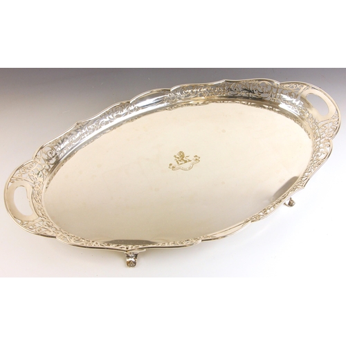 60 - A Mappin and Webb silver plate tray, the pierced gallery with tray handles above an engraved crest w... 