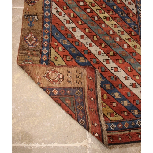 631 - A Sarab hand knotted wool rug, the central field with alternating red, green, blue and white diagona... 