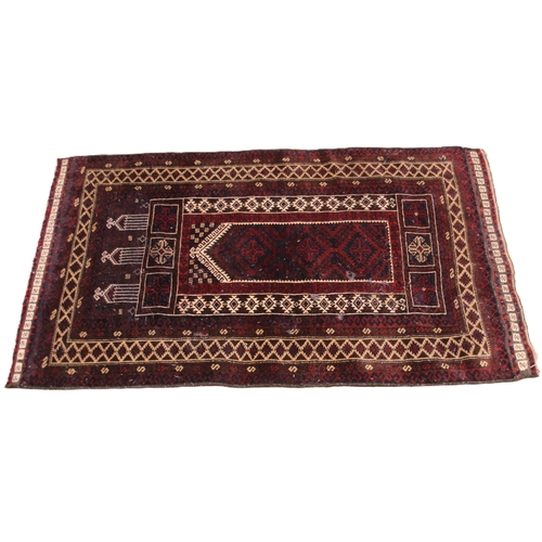 635 - An Afghan Baluchi prayer rug, the red ground with ivory coloured lattice and geometric borders, 136c... 