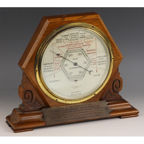 673 - A Short & Mason oak cased Art Deco 'Stormoguide' desk aneroid barometer, retailed by John Bruce & So... 