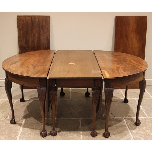 719 - A George III and later mahogany D-end dining table, formed with two D-ends, a central drop leaf tabl... 