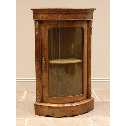 747 - A Victorian burr walnut freestanding corner cabinet, of bowfront form, applied with gilt metal bandi... 