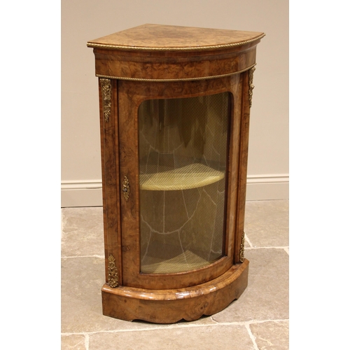 747 - A Victorian burr walnut freestanding corner cabinet, of bowfront form, applied with gilt metal bandi... 