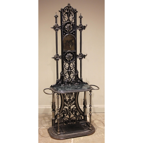 751 - A black and silvered cast iron Coalbrookdale style hall stand, 20th century, the openwork back centr... 