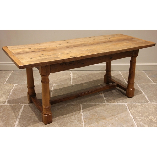 755 - A 17th century style light oak refectory table, 19th century and later, the cleated plank top upon l... 