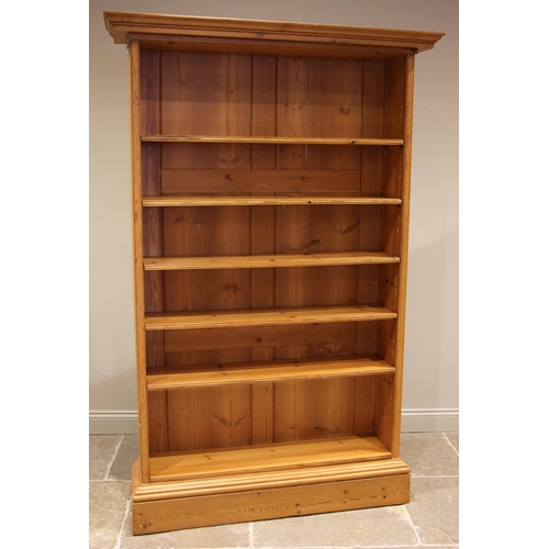 756 - A Victorian pine open bookcase, the moulded cornice over an arrangement of seven adjustable shelves,... 