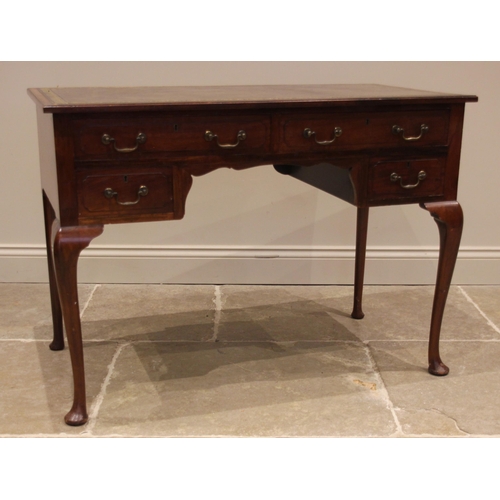 760 - A walnut writing desk in the George II style, early 20th century, the moulded top inset with a gilt ... 