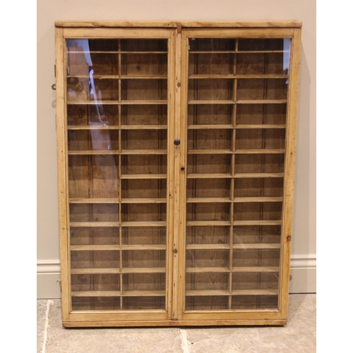 765 - A glazed pine specimen/collectors cabinet, 19th century, each of the twin glazed doors opening to a ... 