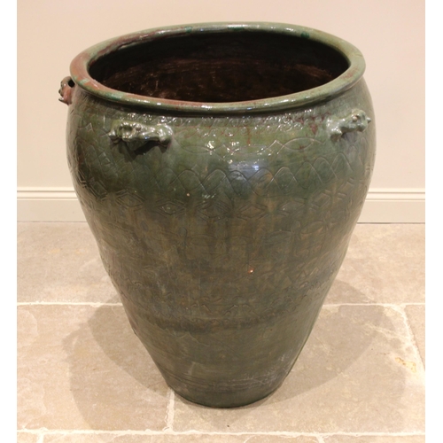 795 - A large Moroccan glazed urn, of typical tapering form, incised with sgraffito detail and applied wit... 