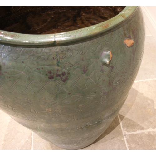 795 - A large Moroccan glazed urn, of typical tapering form, incised with sgraffito detail and applied wit... 