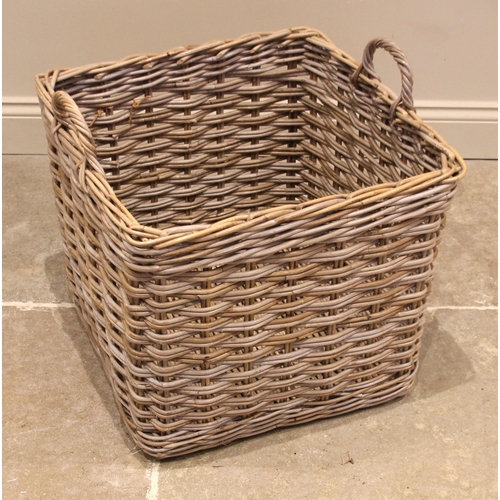 573 - A wicker log basket, of typical cubic form, with loop side handles, 50cm H x 57cm Sq