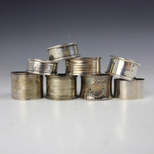 48 - A selection of eight silver napkin rings, including a George V example, West & Son, Dublin 1928, of ... 