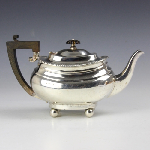 54 - An Edwardian silver teapot, Levesley Brothers, Sheffield 1909, the gadroon rim above plain polished ... 